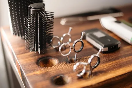 pexels-photo-3992874-3992874-1 Close-up of barber tools on a stylish wooden counter, perfect for a salon setting.